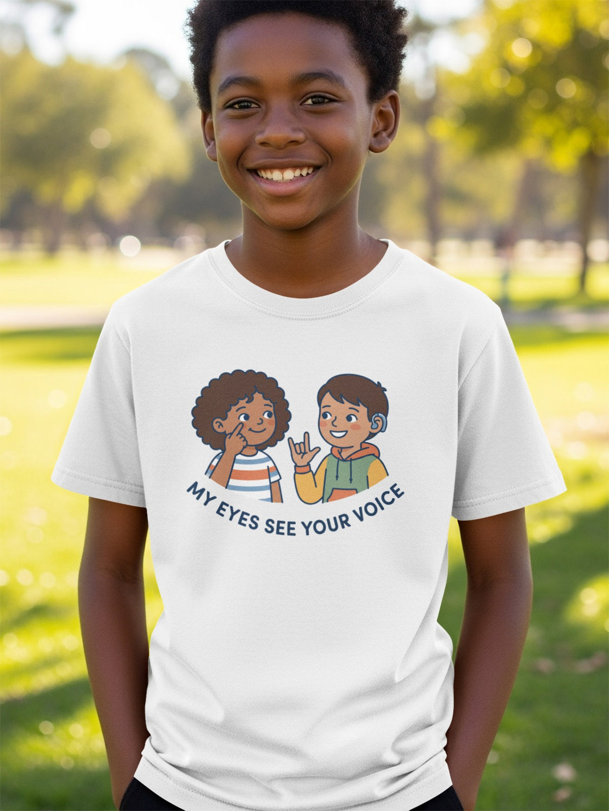 White t-shirt with cartoon of two children and text "My Eyes See Your Voice".