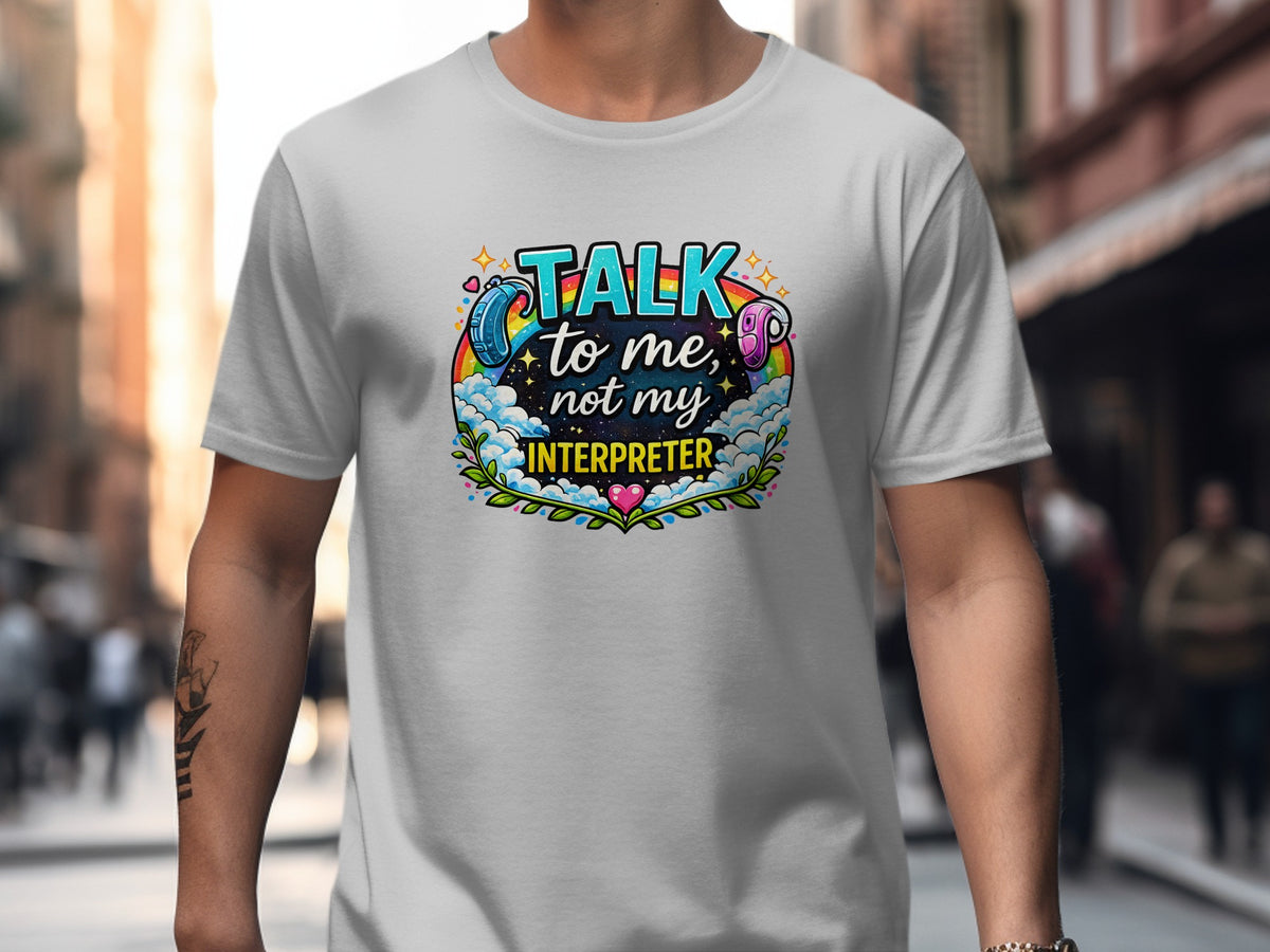 White t-shirt with "Talk to me, not my interpreter" text and rainbow, clouds, and hearing aid graphics.