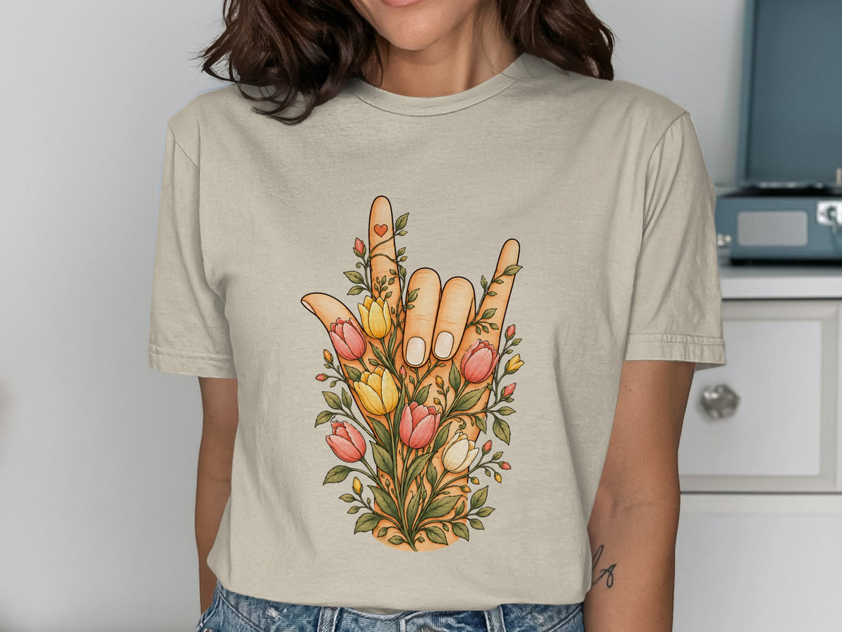 T-shirt with a hand forming "I love you" sign, adorned with flowers.