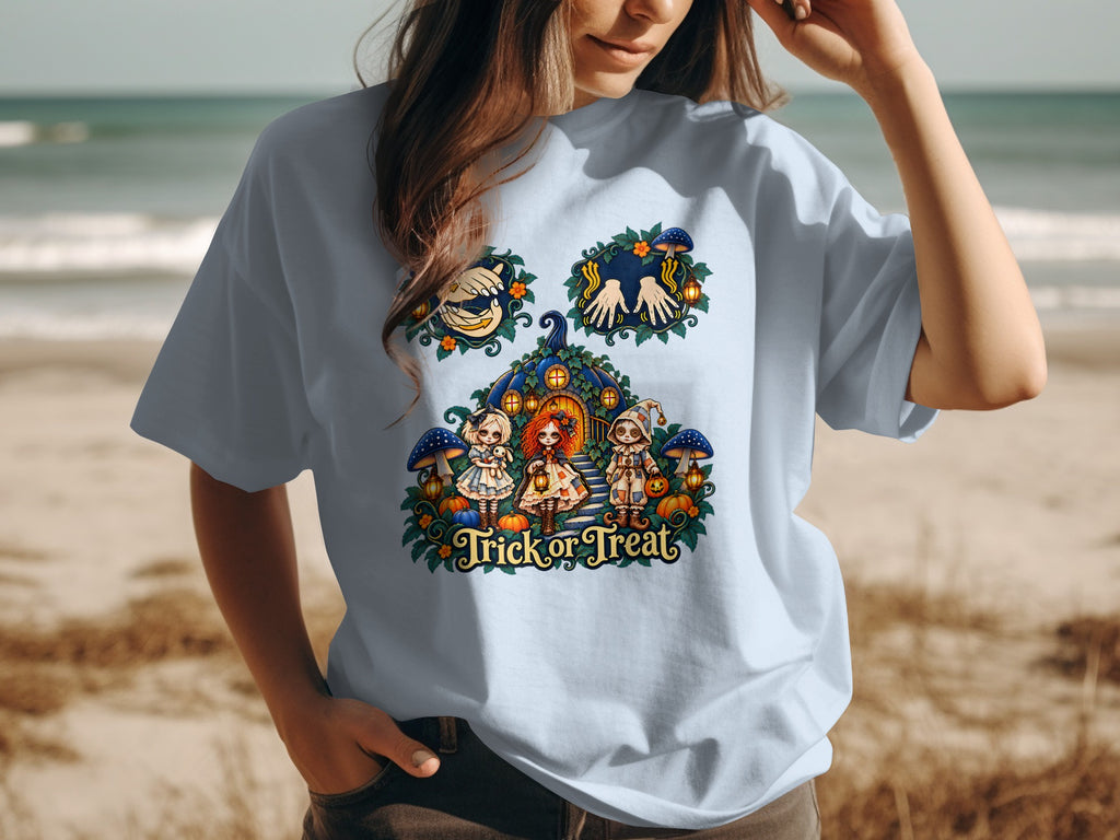 T-shirt with "Trick or Treat" text and Halloween graphic of dolls, pumpkins, and mushrooms.