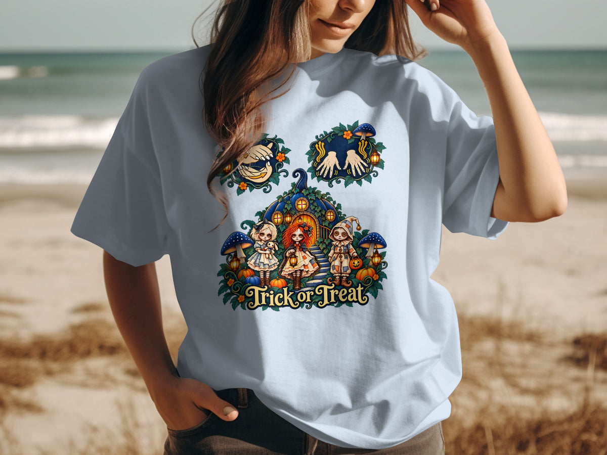 T-shirt with "Trick or Treat" text and Halloween graphic of dolls, pumpkins, and mushrooms.