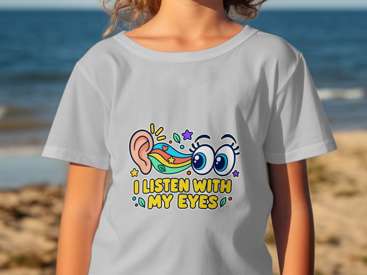 Gray t-shirt with colorful ear, eyes, and text "I LISTEN WITH MY EYES".