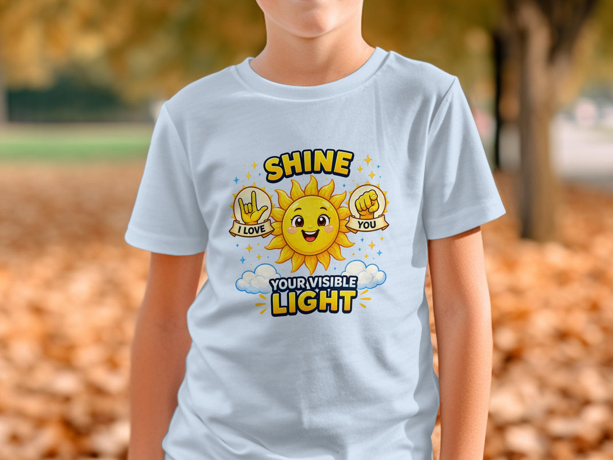 Light blue t-shirt with "SHINE YOUR VISIBLE LIGHT" and sun graphic.