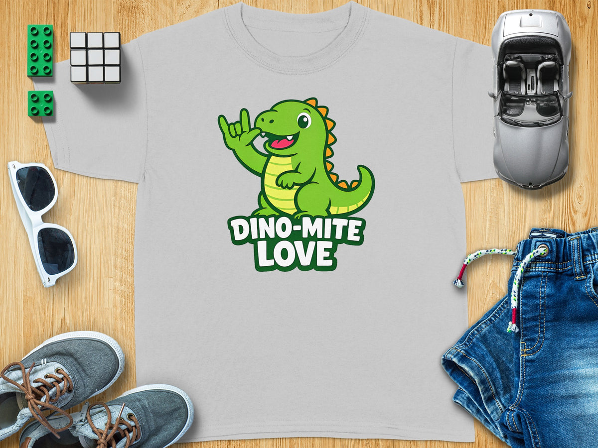 Light grey t-shirt with a green cartoon dinosaur and text "DINO-MITE LOVE".