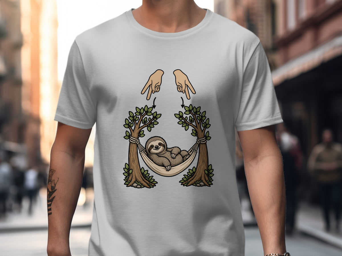 Sloth in hammock between trees with hands and arrows on a light gray t-shirt.