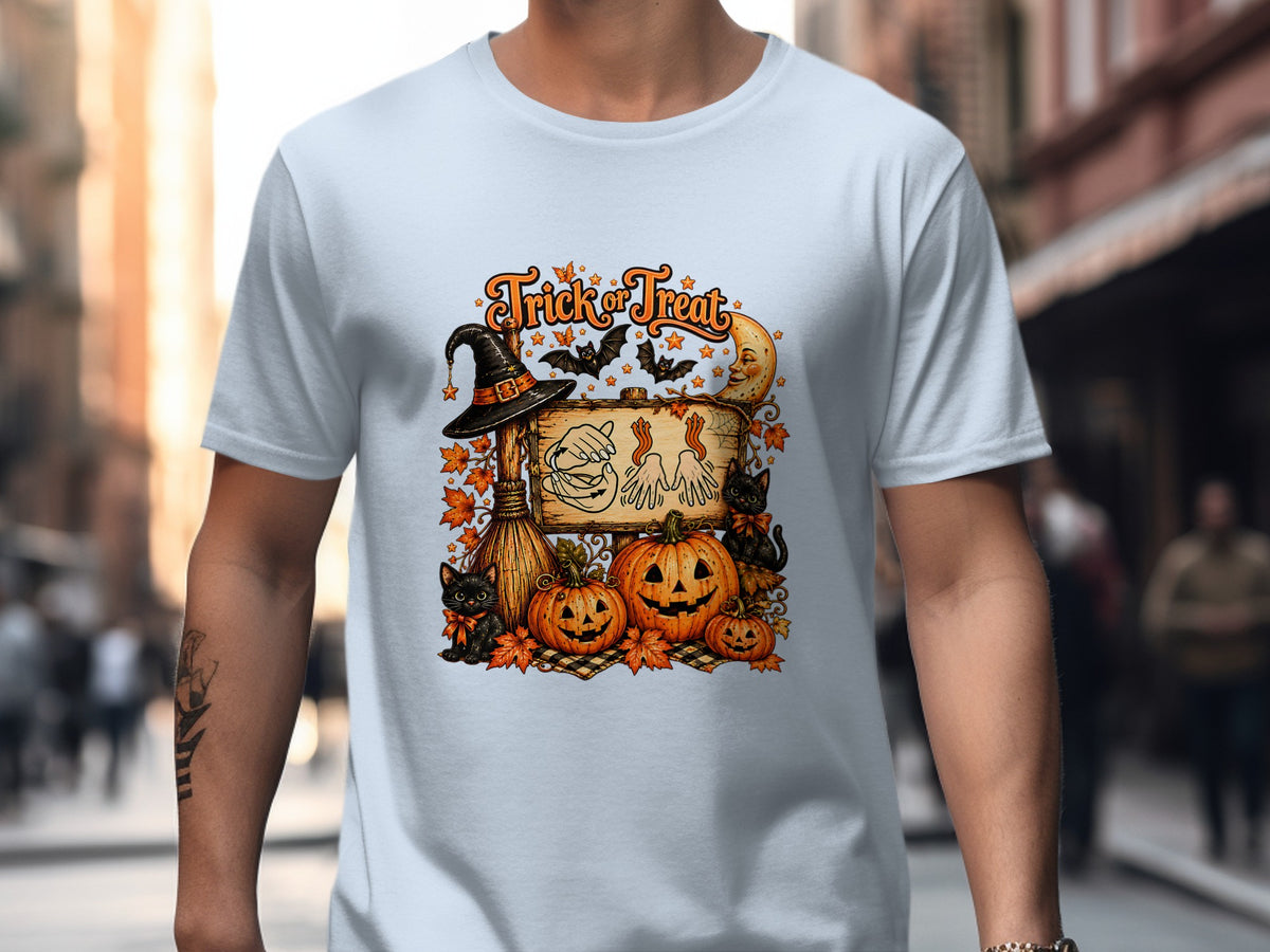 "Trick or Treat" Halloween graphic with pumpkins, black cats, witch's hat, and moon.
