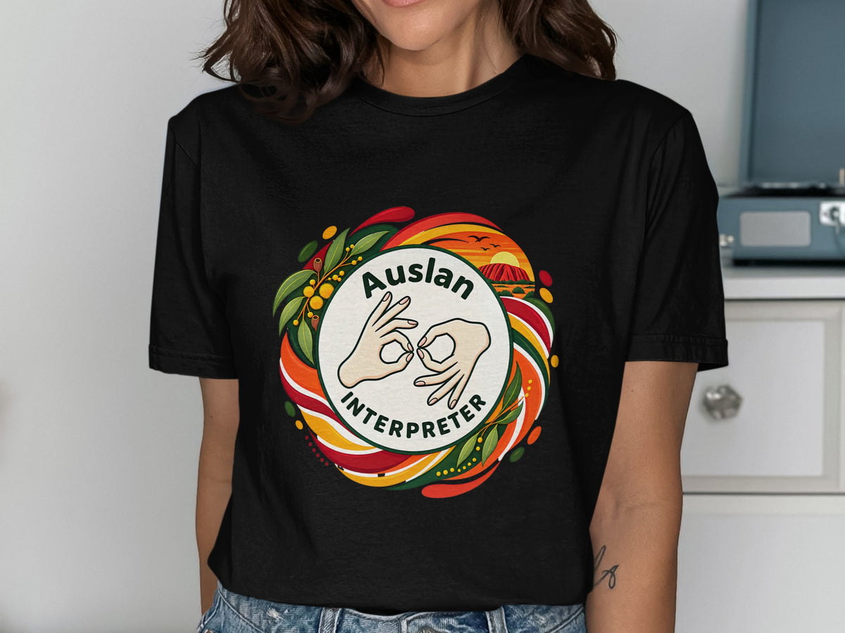 Auslan Interpreter graphic with Australian landscape and floral border on black t-shirt.