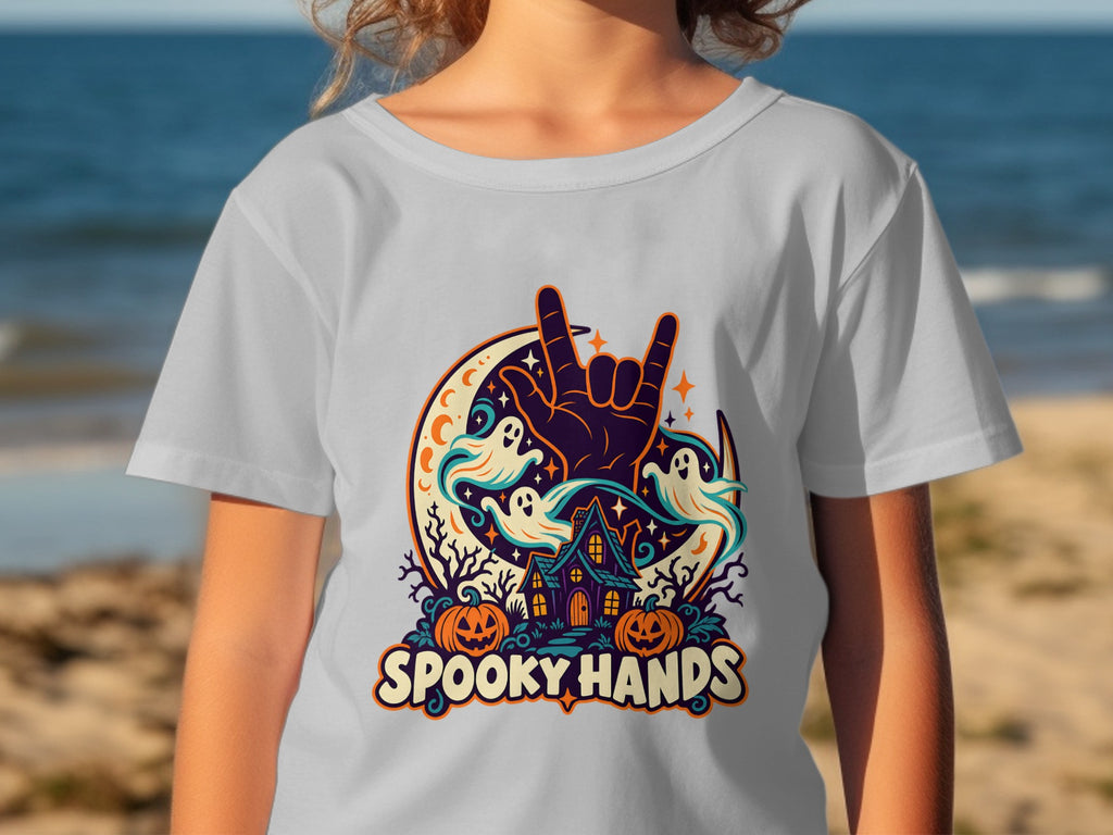 T-shirt with "Spooky Hands" Halloween design featuring ghosts, pumpkins, and a haunted house.