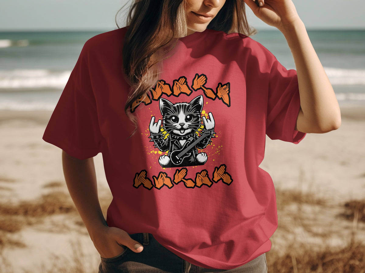 Red t-shirt with graphic of a rock and roll cat playing guitar with handsigns above and below.