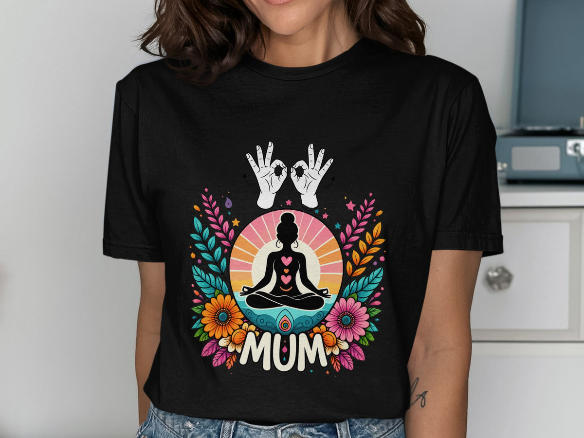 Black t-shirt with colorful floral design featuring a meditating figure and the word "MUM".