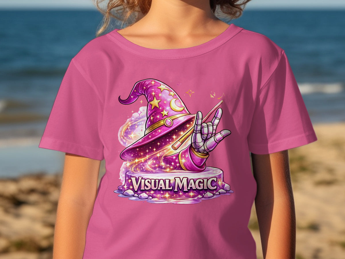 Pink t-shirt with glittery wizard hat and text "VISUAL MAGIC".