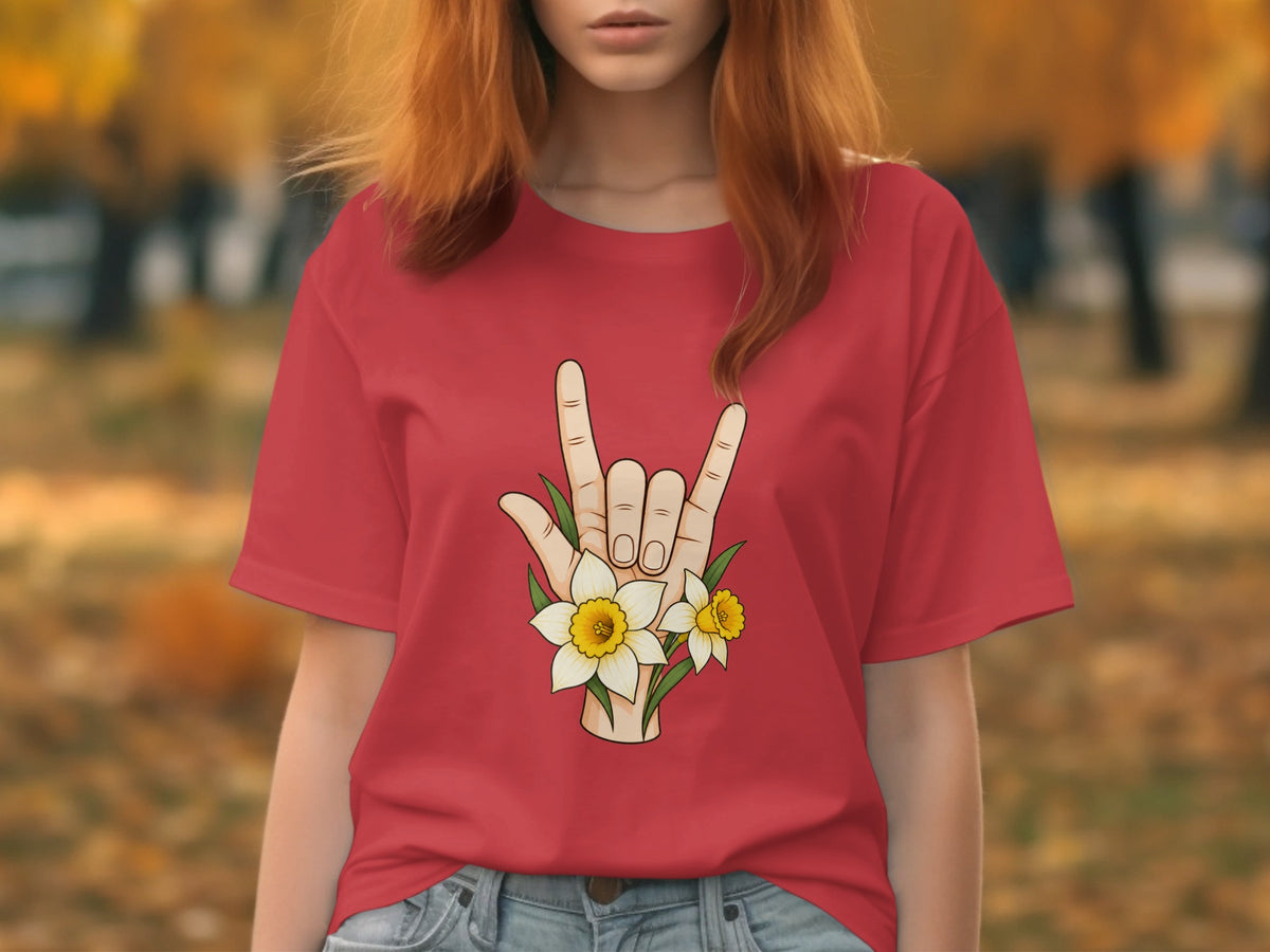 Red t-shirt with a hand gesture and daffodils graphic on the chest.