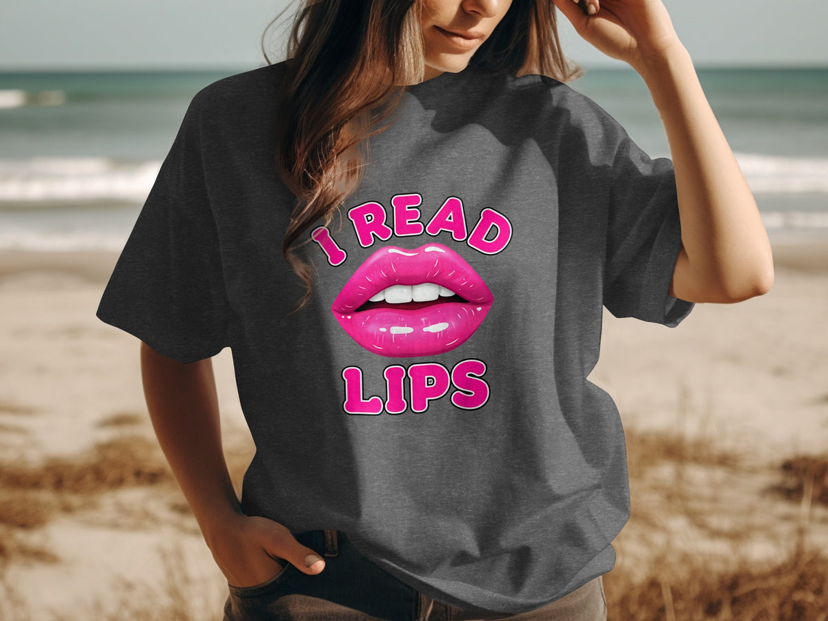 Dark grey t-shirt with pink lips graphic and text "I READ LIPS."