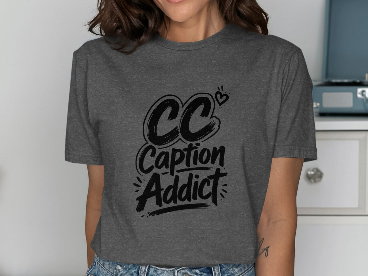 Dark gray t-shirt with black text: CC Caption Addict and a small heart.