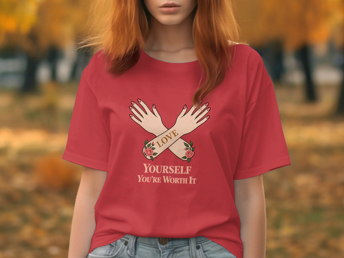 Red t-shirt with crossed arms graphic and text "LOVE YOURSELF YOU'RE WORTH IT".