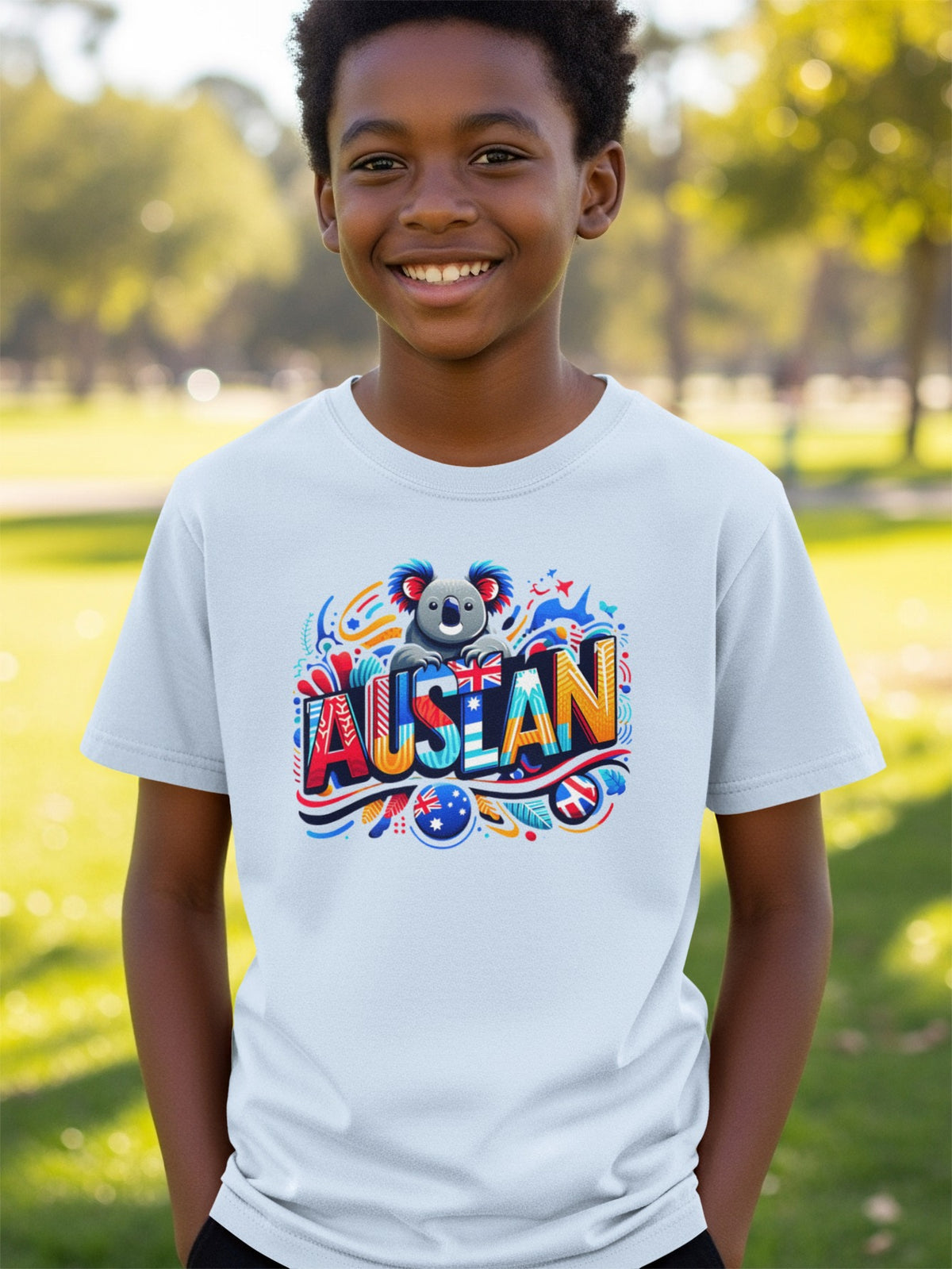 Child wearing light blue t-shirt with colorful "AUSTRALIA" text and a cartoon koala.