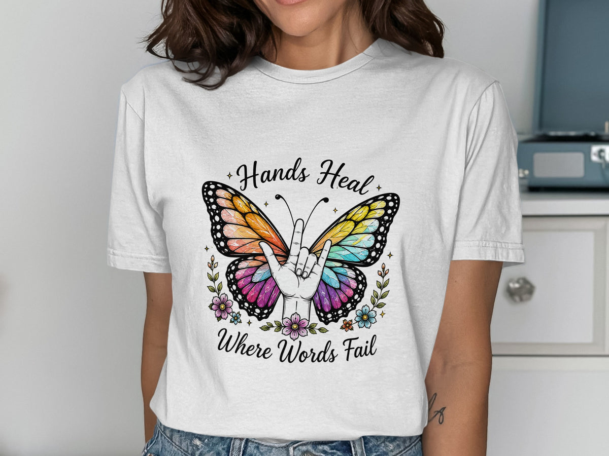 Butterfly graphic with hand sign and text "Hands Heal Where Words Fail".