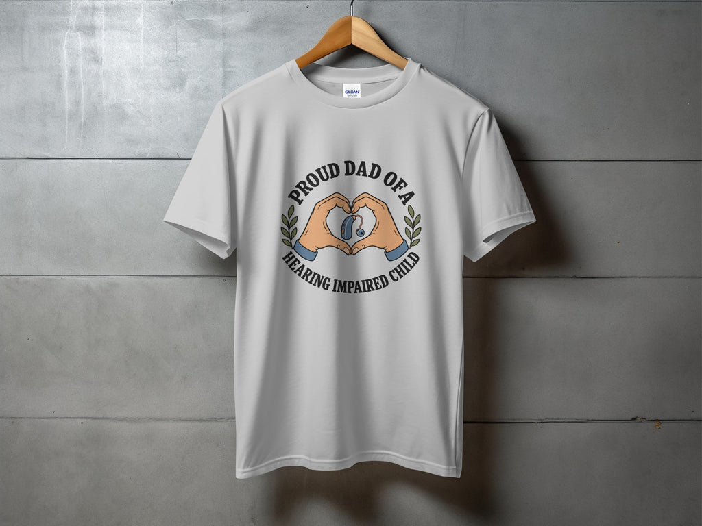White t-shirt with graphic of hands forming a heart around a hearing aid and text "Proud Dad of a Hearing Impaired Child".