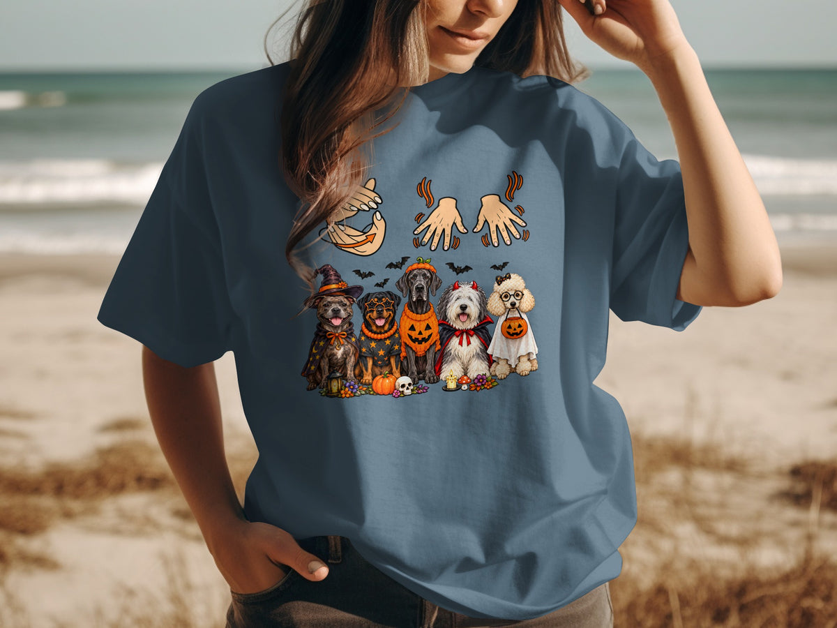 Five dogs in Halloween costumes lined up with pumpkins and bats.