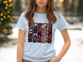 Light blue t-shirt with a vibrant, multi-panel Halloween graphic featuring vampires and skeletons.
