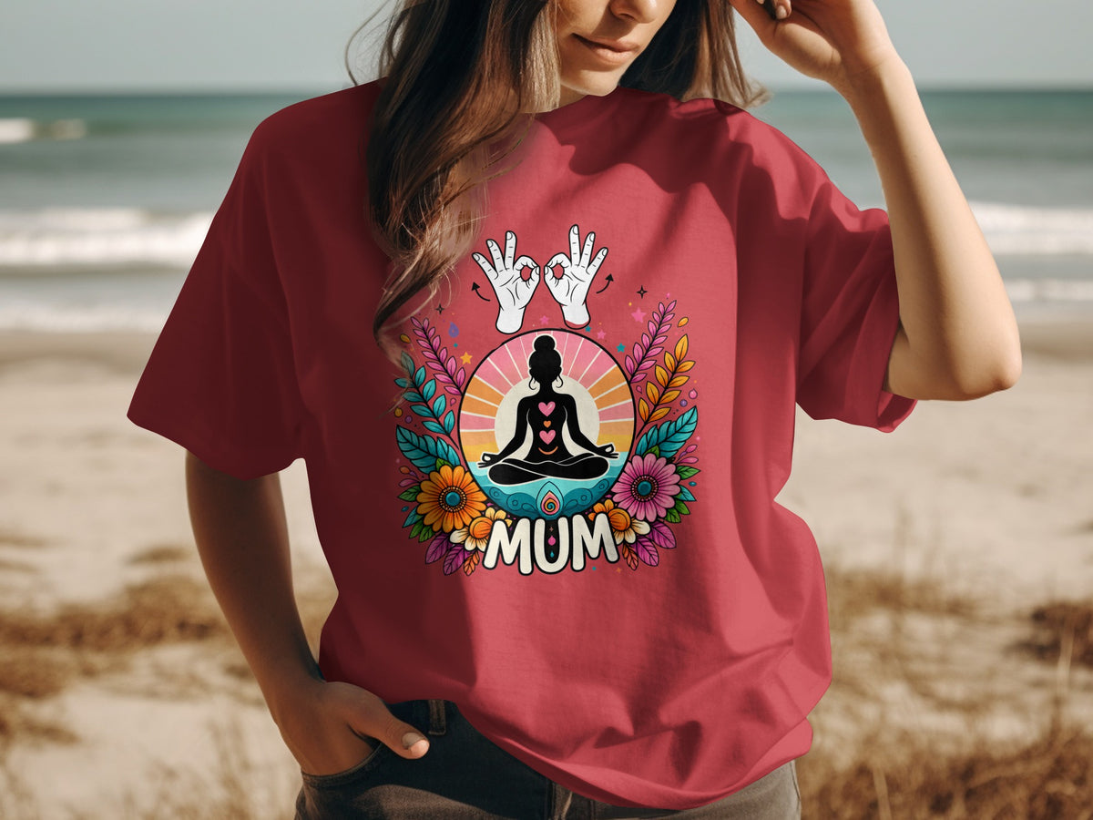 Maroon t-shirt with colorful floral design featuring a meditating figure and "MUM".