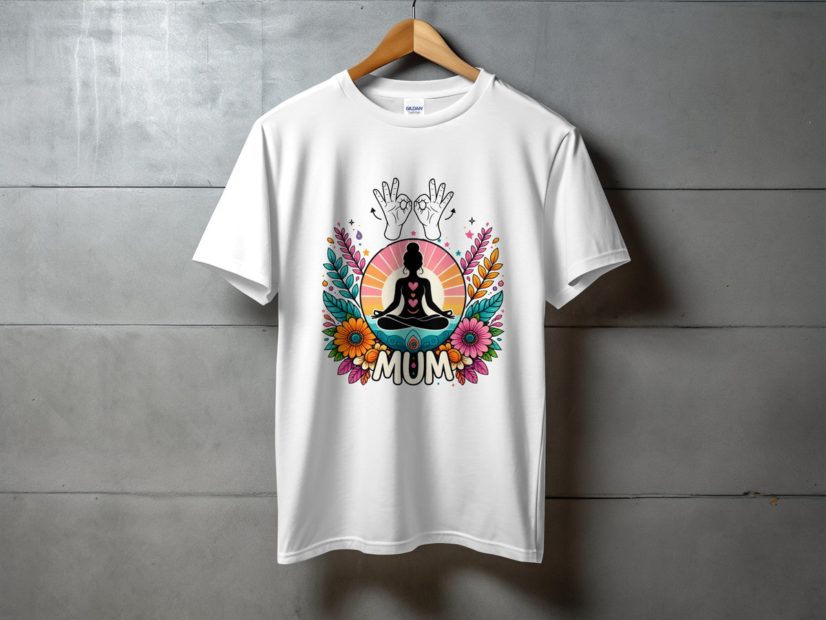 White t-shirt with colorful "MUM" graphic featuring a meditating person and floral design.