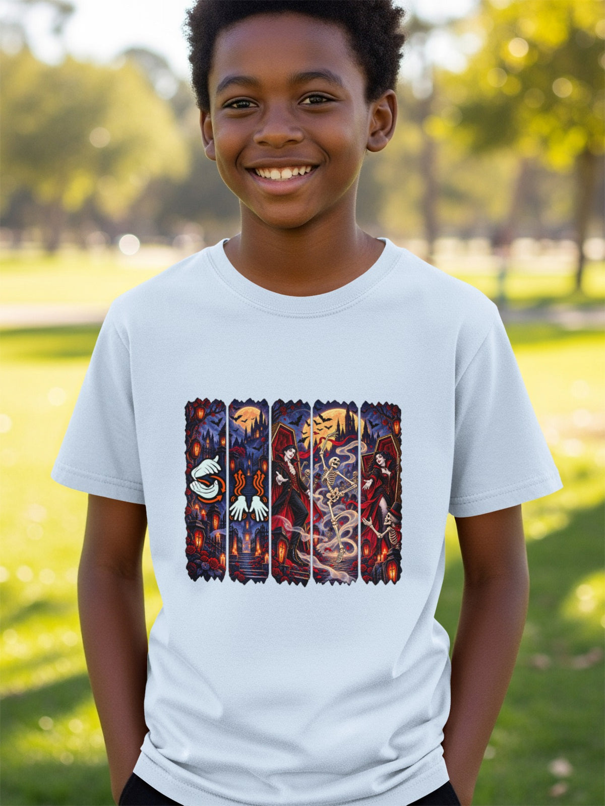 Light blue t-shirt with a Halloween-themed graphic of vampires, skeletons, and coffins.