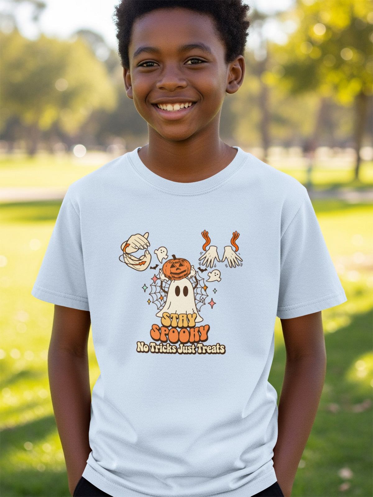 Light blue t-shirt with "Stay Spooky No Tricks Just Treats" Halloween graphic.