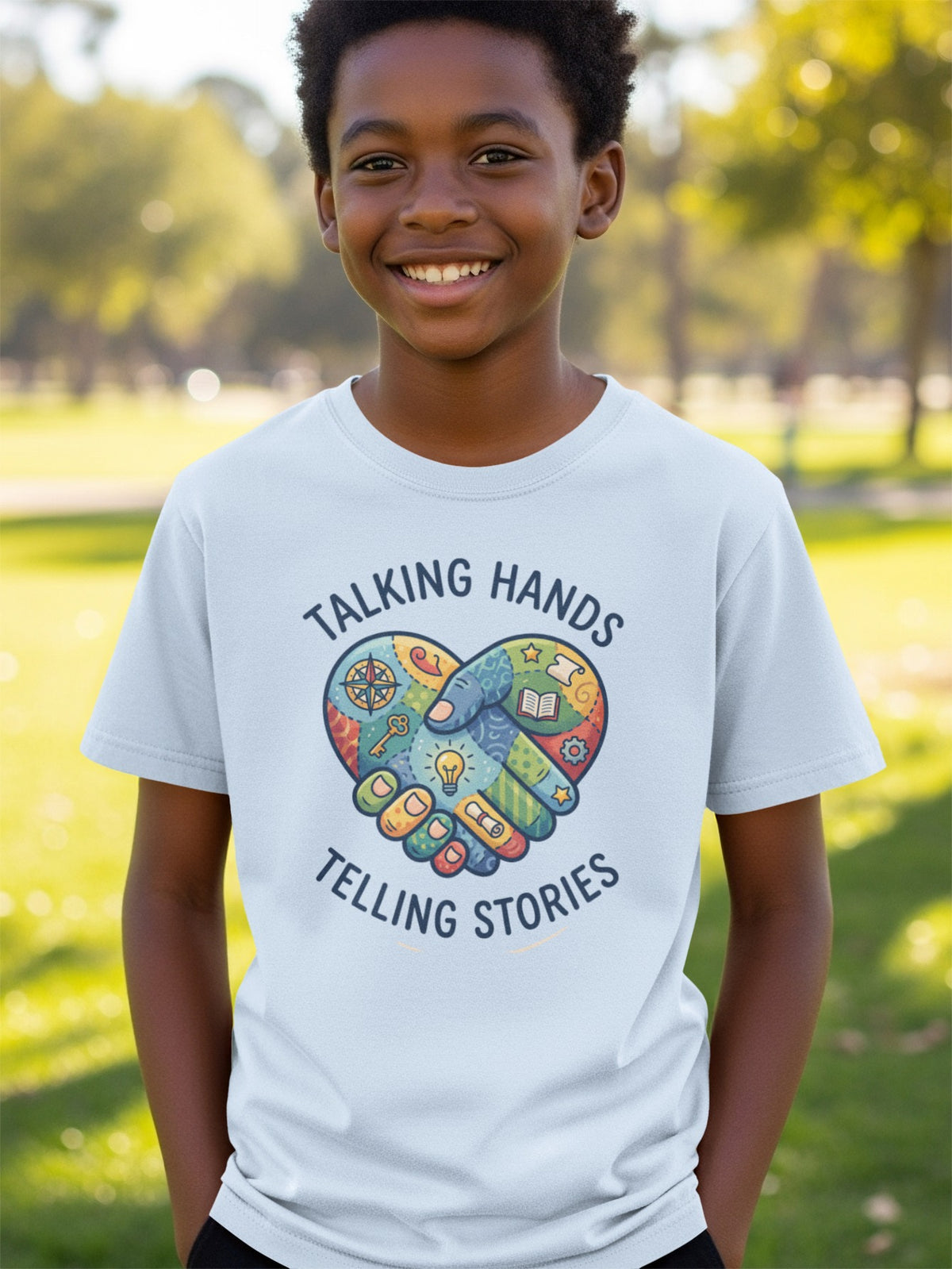 Light blue t-shirt with "Talking Hands Telling Stories" and heart-shaped handshake graphic.