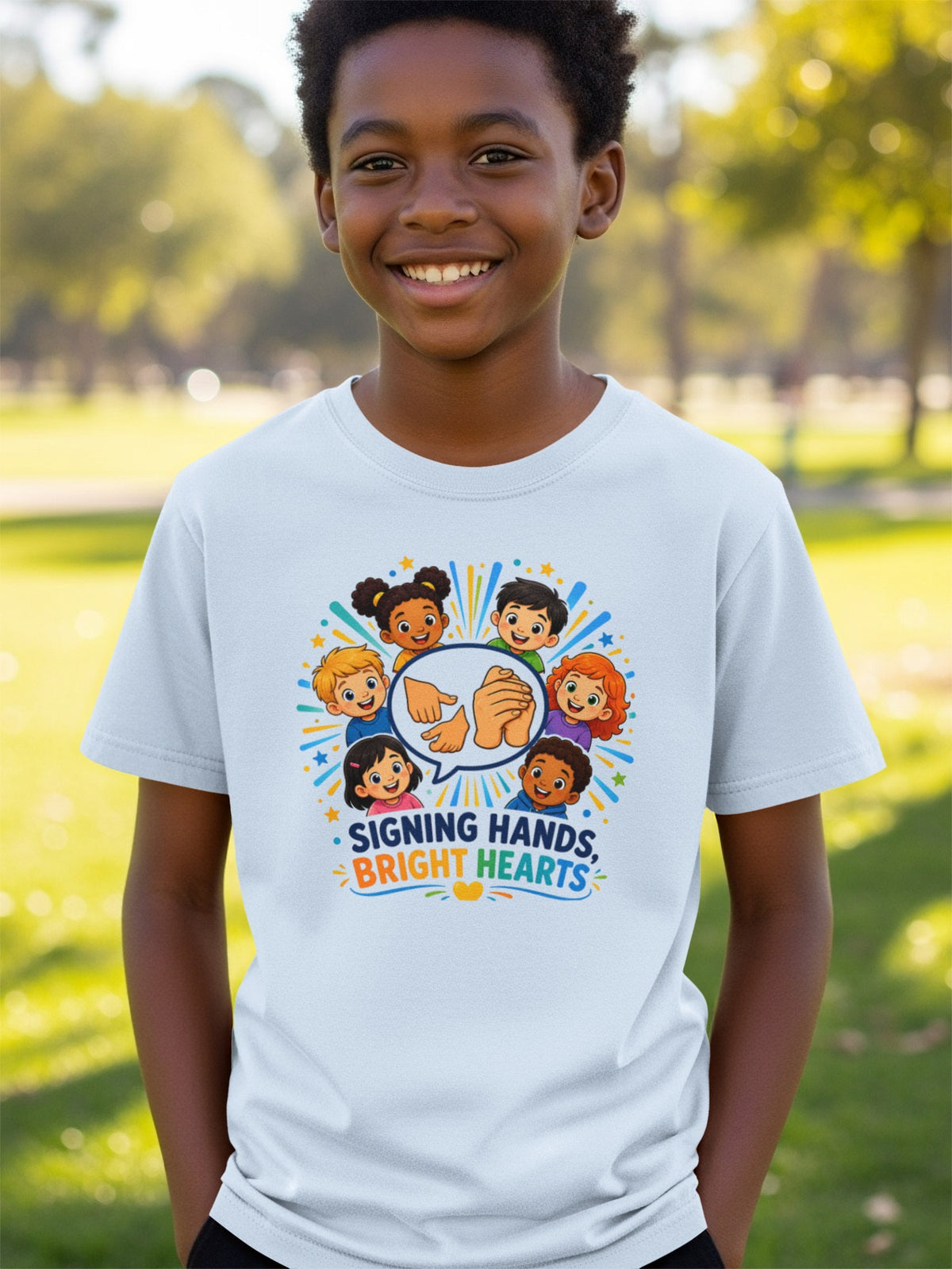 T-shirt with cartoon children and "Signing Hands, Bright Hearts" text.