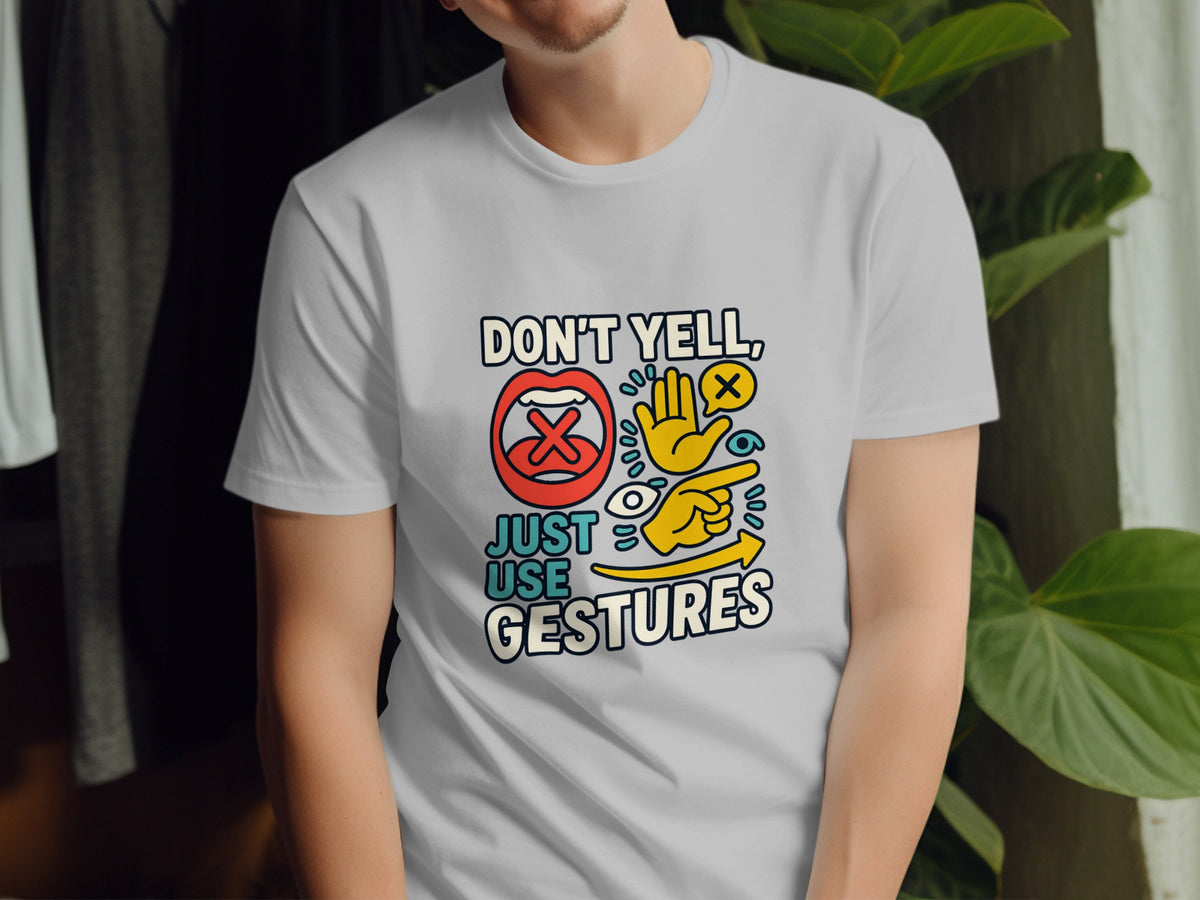White t-shirt with colorful graphic saying "Don't Yell, Just Use Gestures".