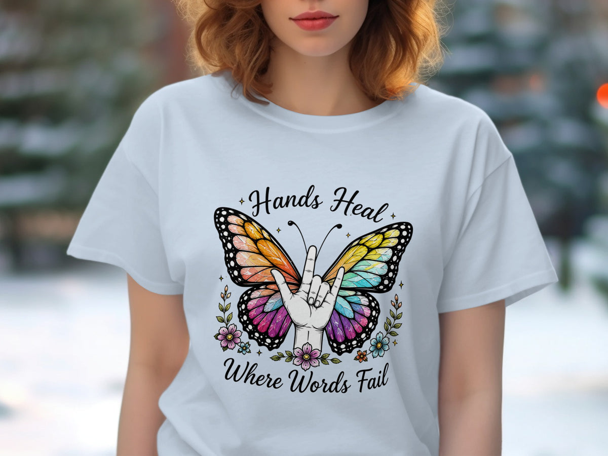 Butterfly with ILY hand gesture and text "Hands Heal Where Words Fail".