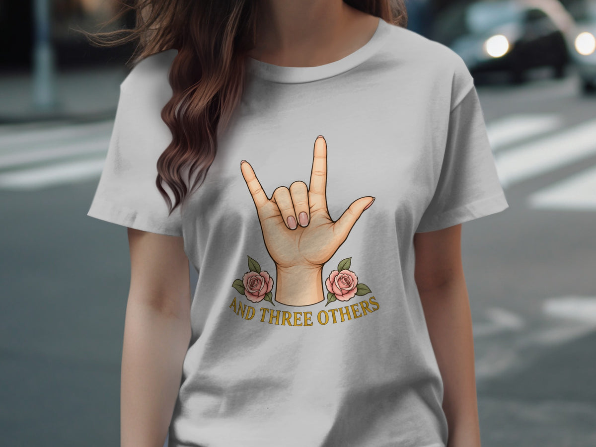 Light grey t-shirt with hand sign and roses graphic saying "AND THREE OTHERS".