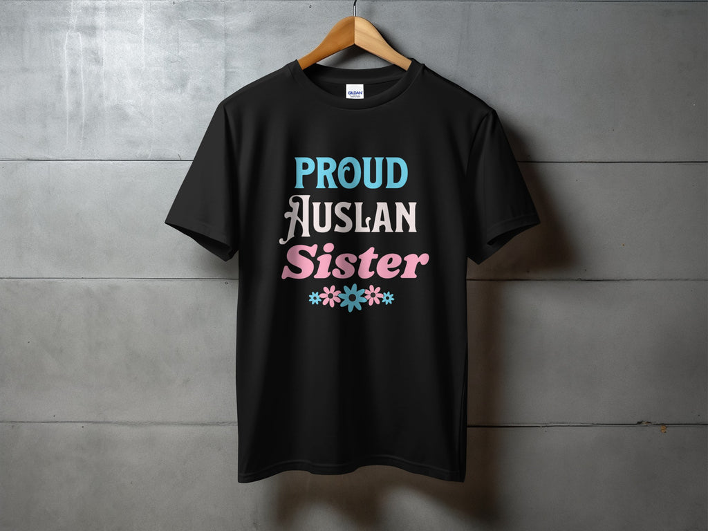 Black t-shirt with "PROUD AUSLAN SISTER" text and floral accents.