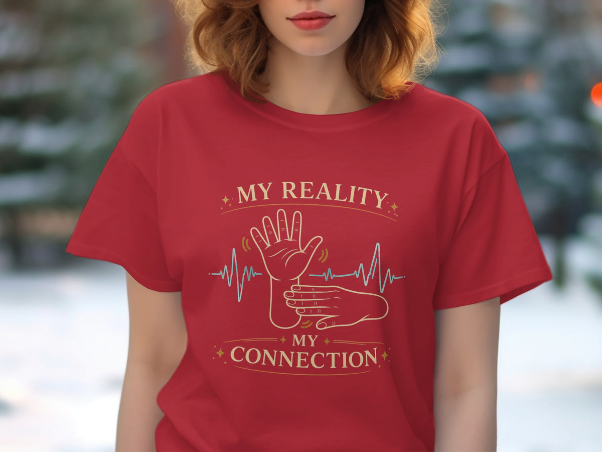 Red t-shirt with gold text "MY REALITY MY CONNECTION" and sign language hands.