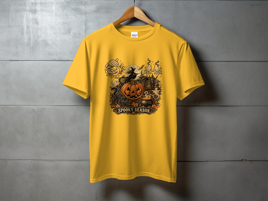 Yellow t-shirt with "Spooky Season" Halloween graphic featuring a witch, pumpkin, and haunted house.