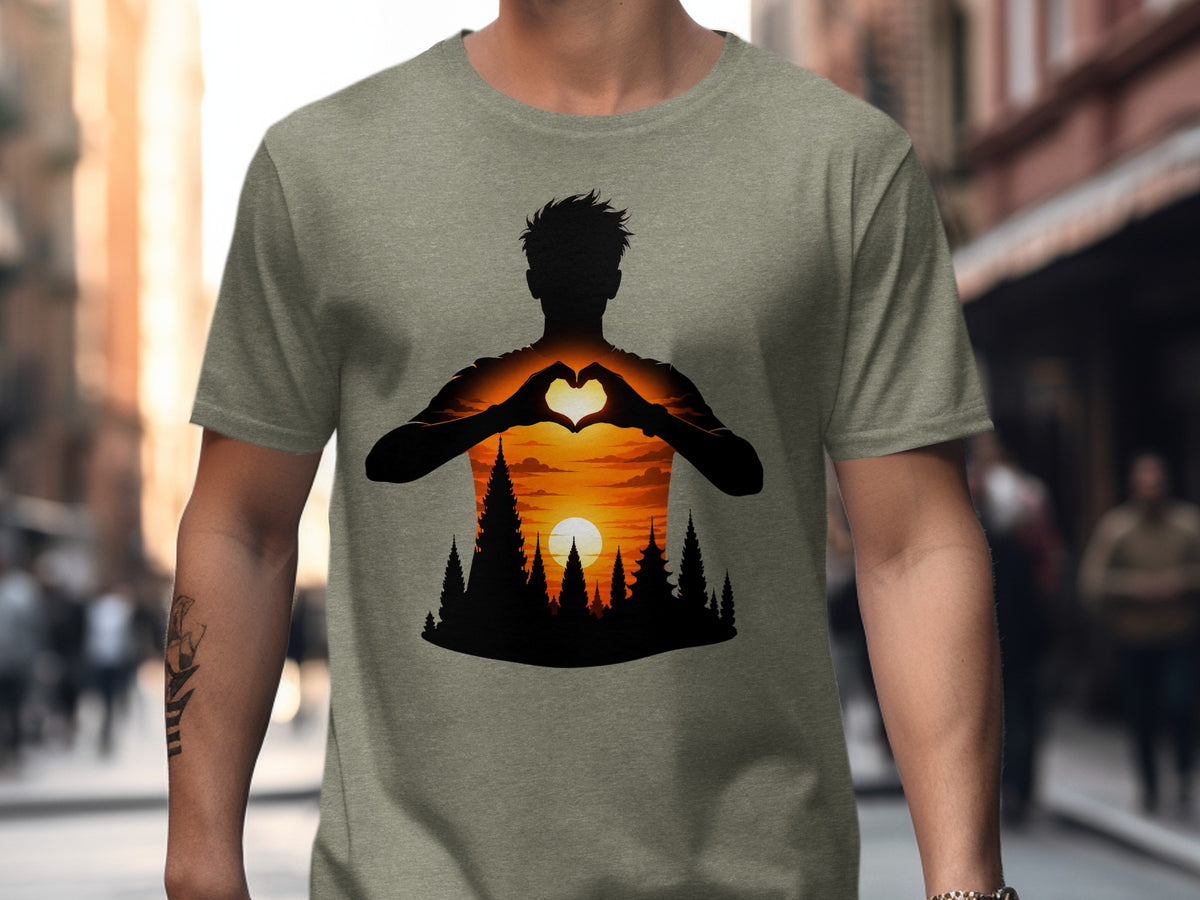 Silhouette of person making heart shape with hands over sunset and forest scene.