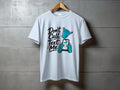 Light blue t-shirt with "Don't Call Text Me" graphic and cartoon hands holding a smartphone.