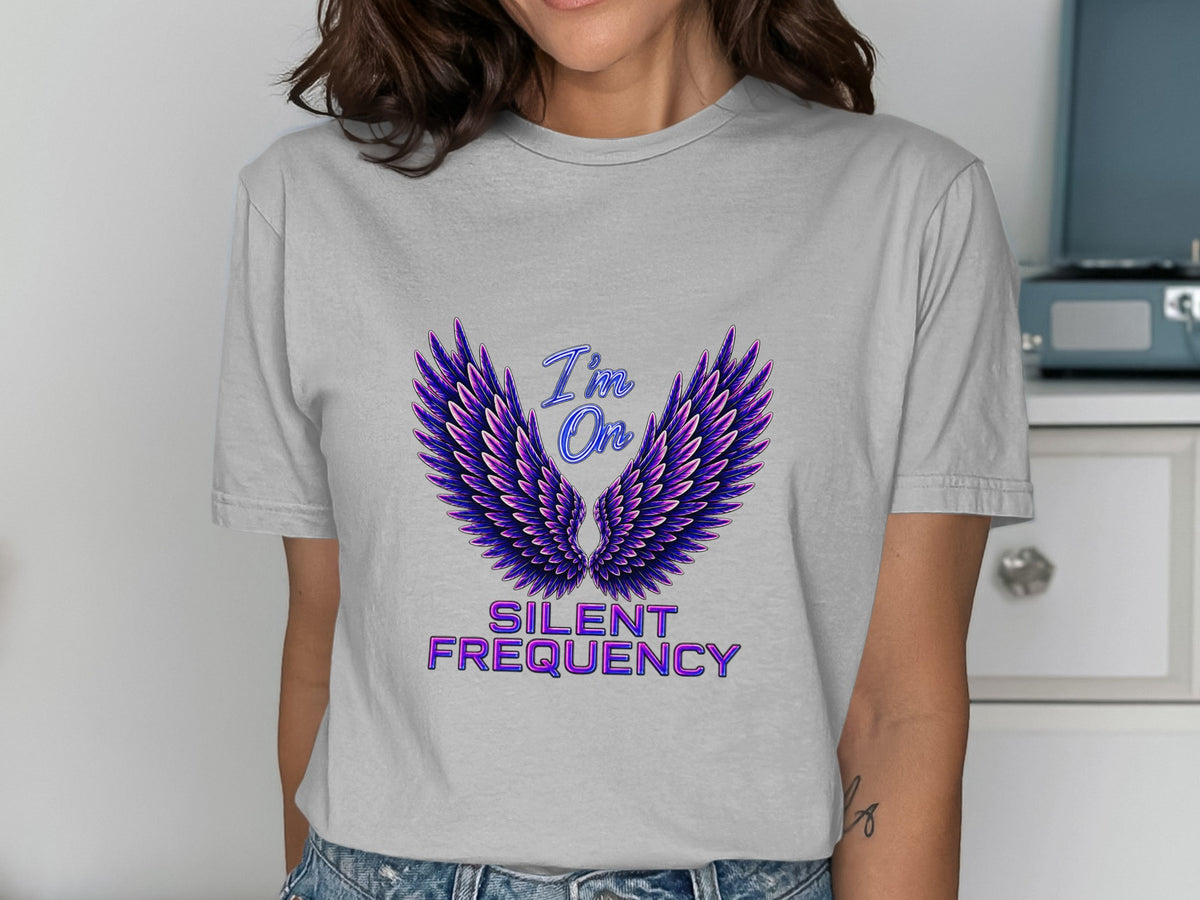 Grey t-shirt with purple and blue wings and text "I'm On Silent Frequency."