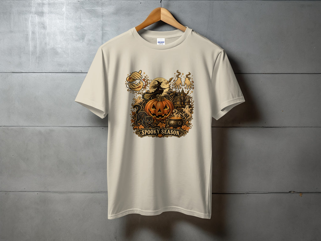 Cream t-shirt with a "Spooky Season" Halloween graphic featuring a witch, pumpkin, and haunted house.