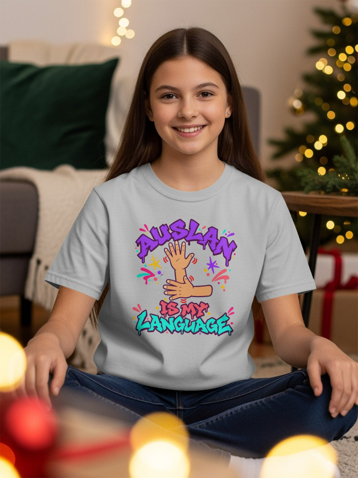 Gray t-shirt with "AUSLAN IS MY LANGUAGE" graphic featuring hands and colorful text.
