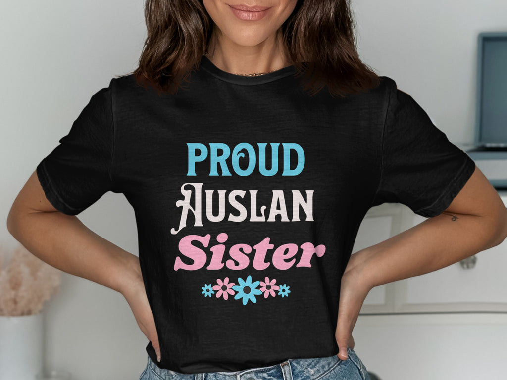 Black t-shirt with "Proud Auslan Sister" text and floral accents.