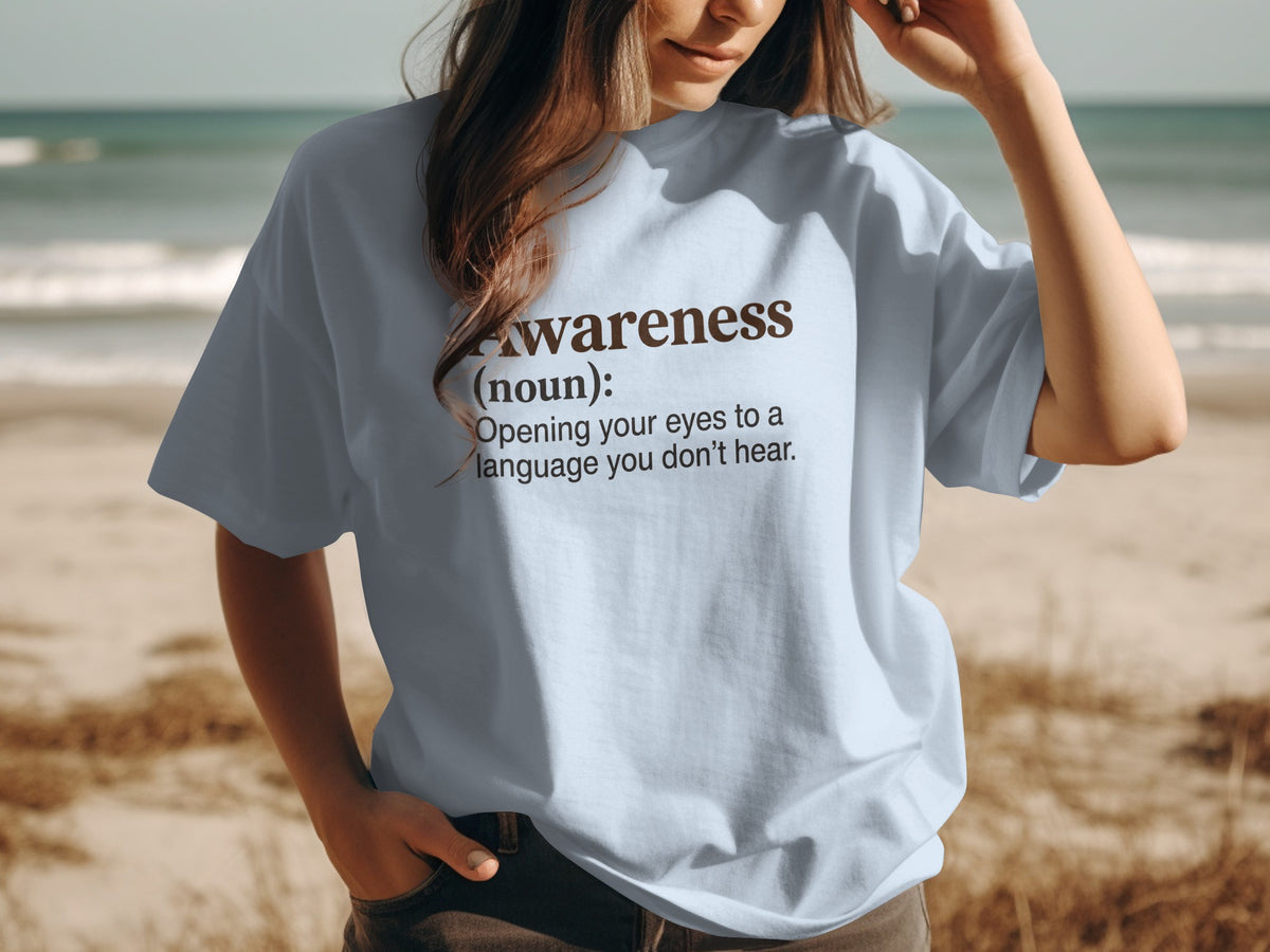 Light blue t-shirt with definition of "Awareness" in brown text.