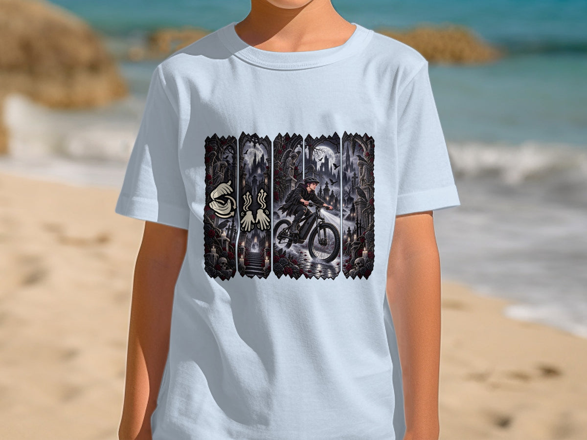 Light blue t-shirt featuring a gothic graveyard scene with a person riding a bicycle.