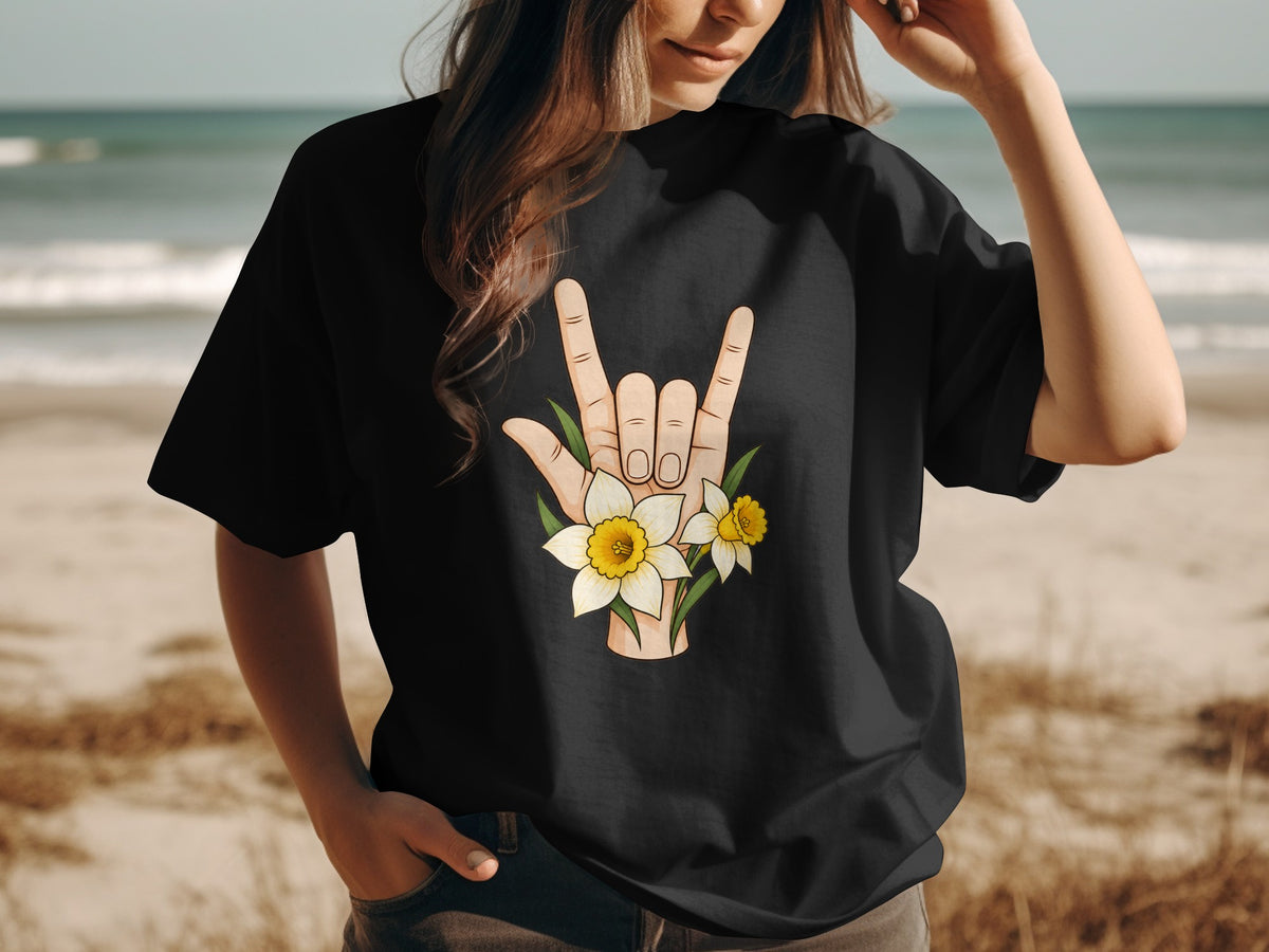 Black t-shirt with a hand making the rock-on sign adorned with daffodils.