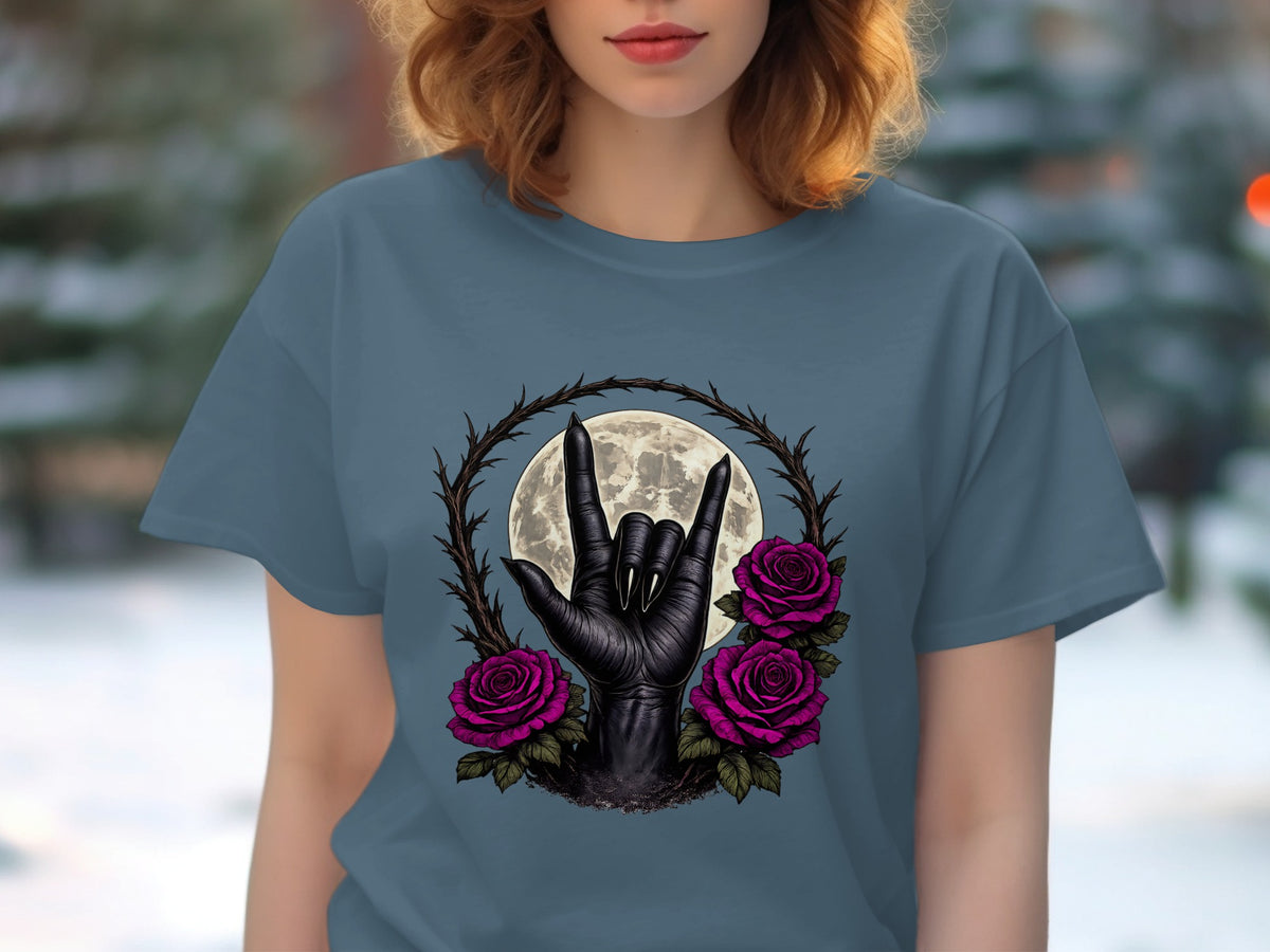 Black hand making rock-on sign with roses and moon on a blue t-shirt.
