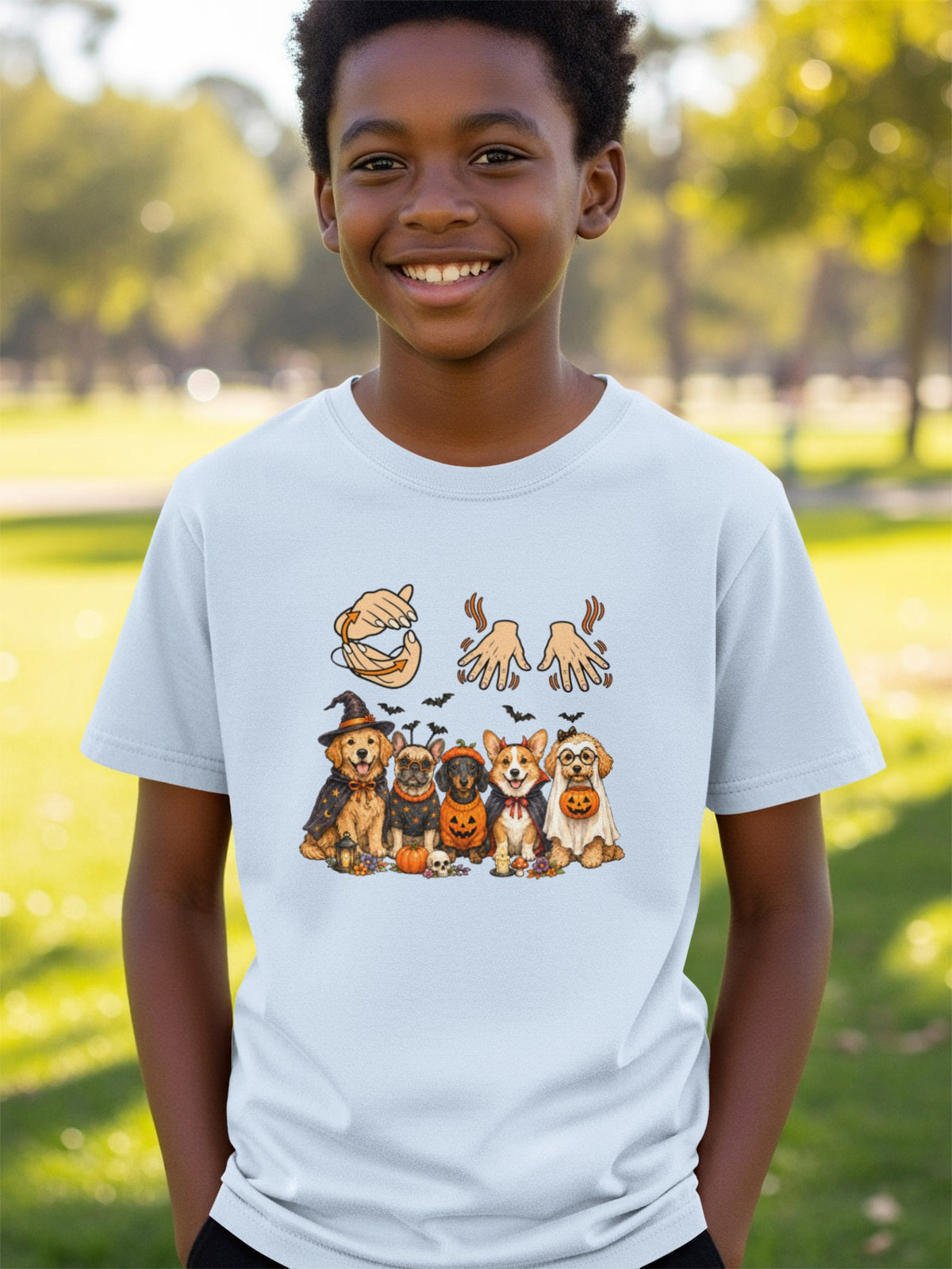T-shirt with dogs in Halloween costumes, pumpkins, bats, and hand gestures.