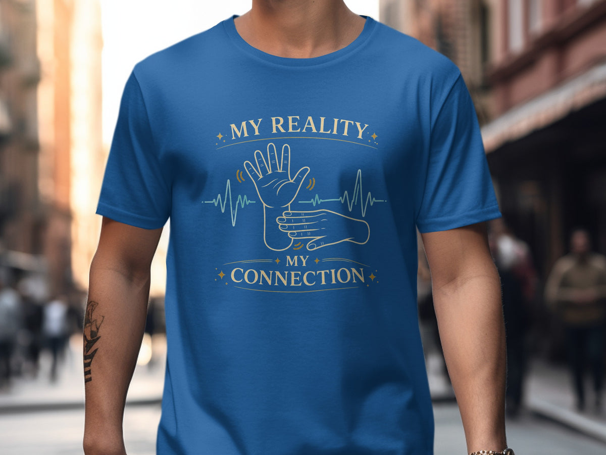 Blue t-shirt with "MY REALITY MY CONNECTION" and hands signing.