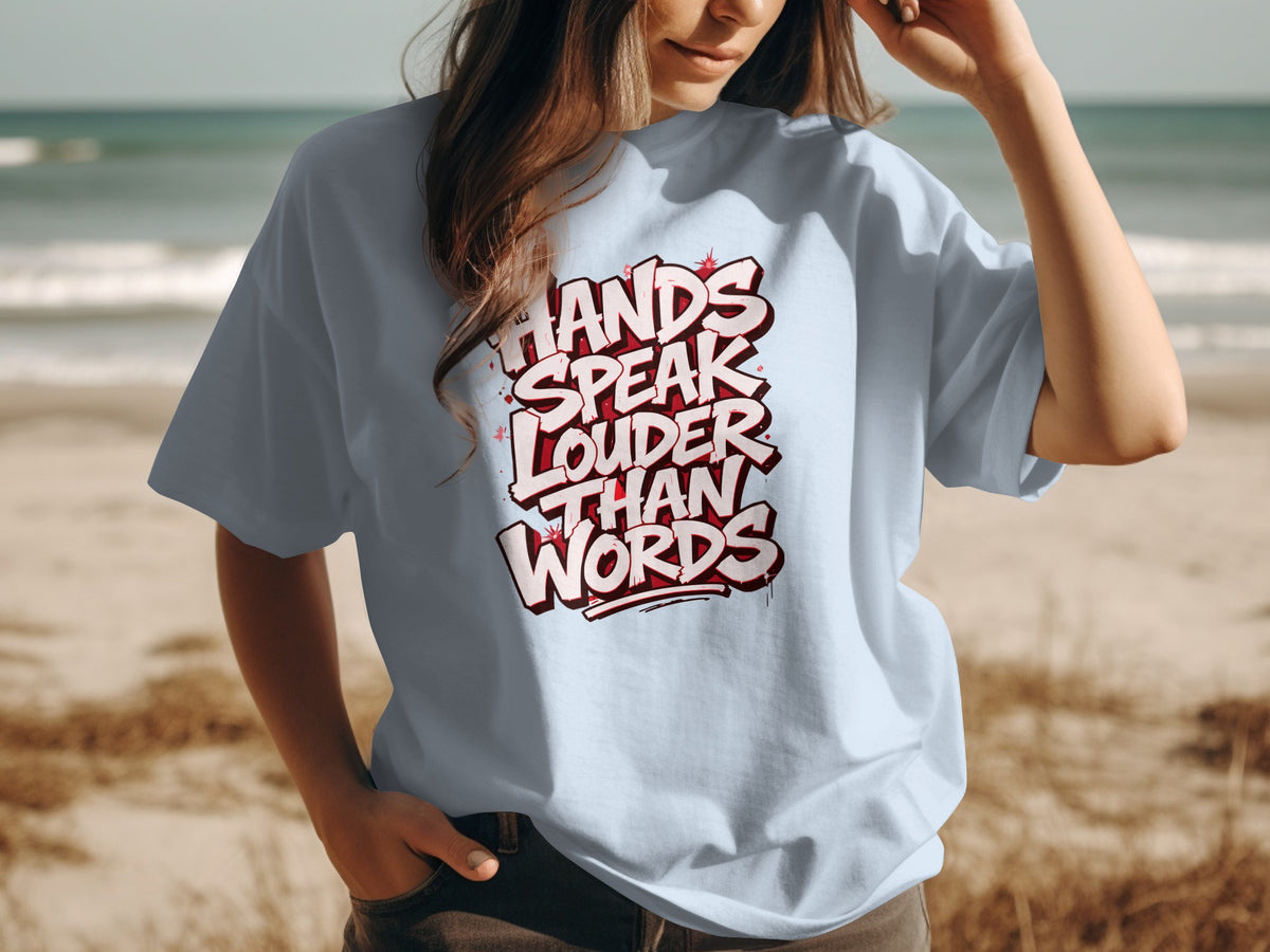 Light blue t-shirt with white text that reads "Hands Speak Louder Than Words".