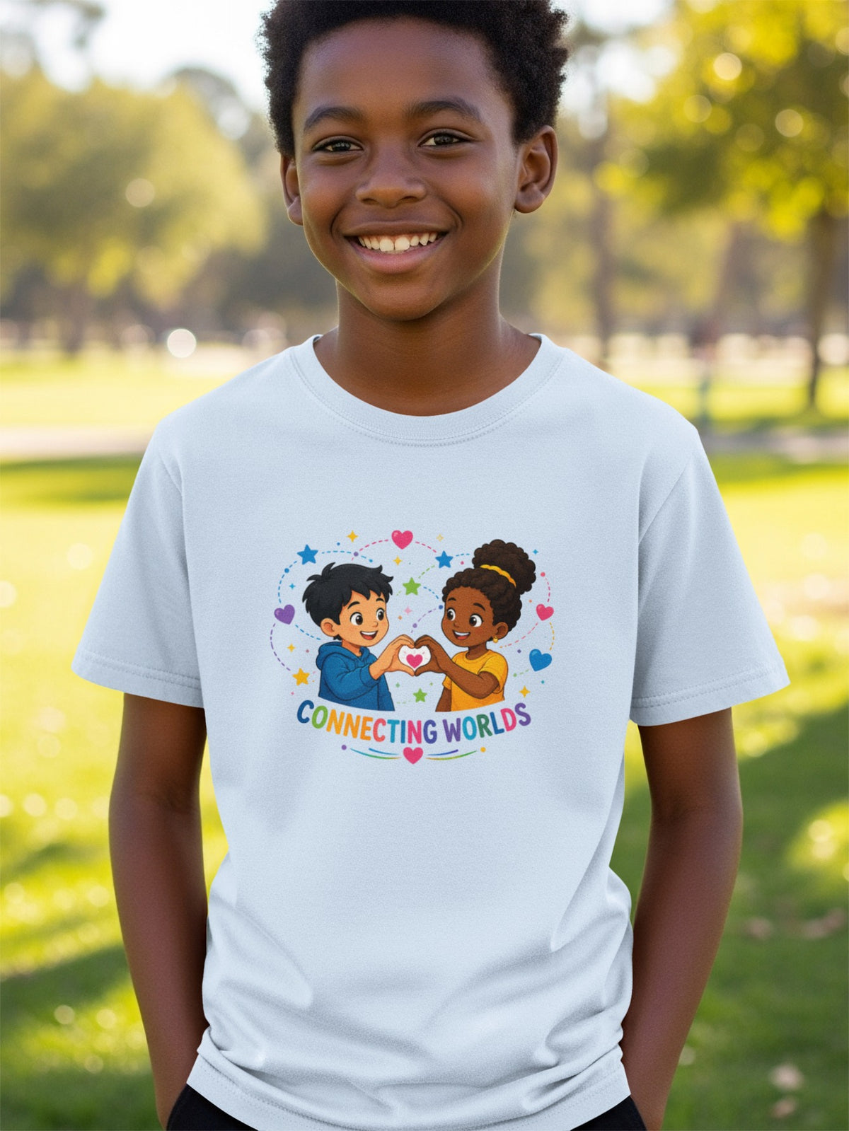 Light blue t-shirt with cartoon of two children making a heart with hands, text "CONNECTING WORLDS."